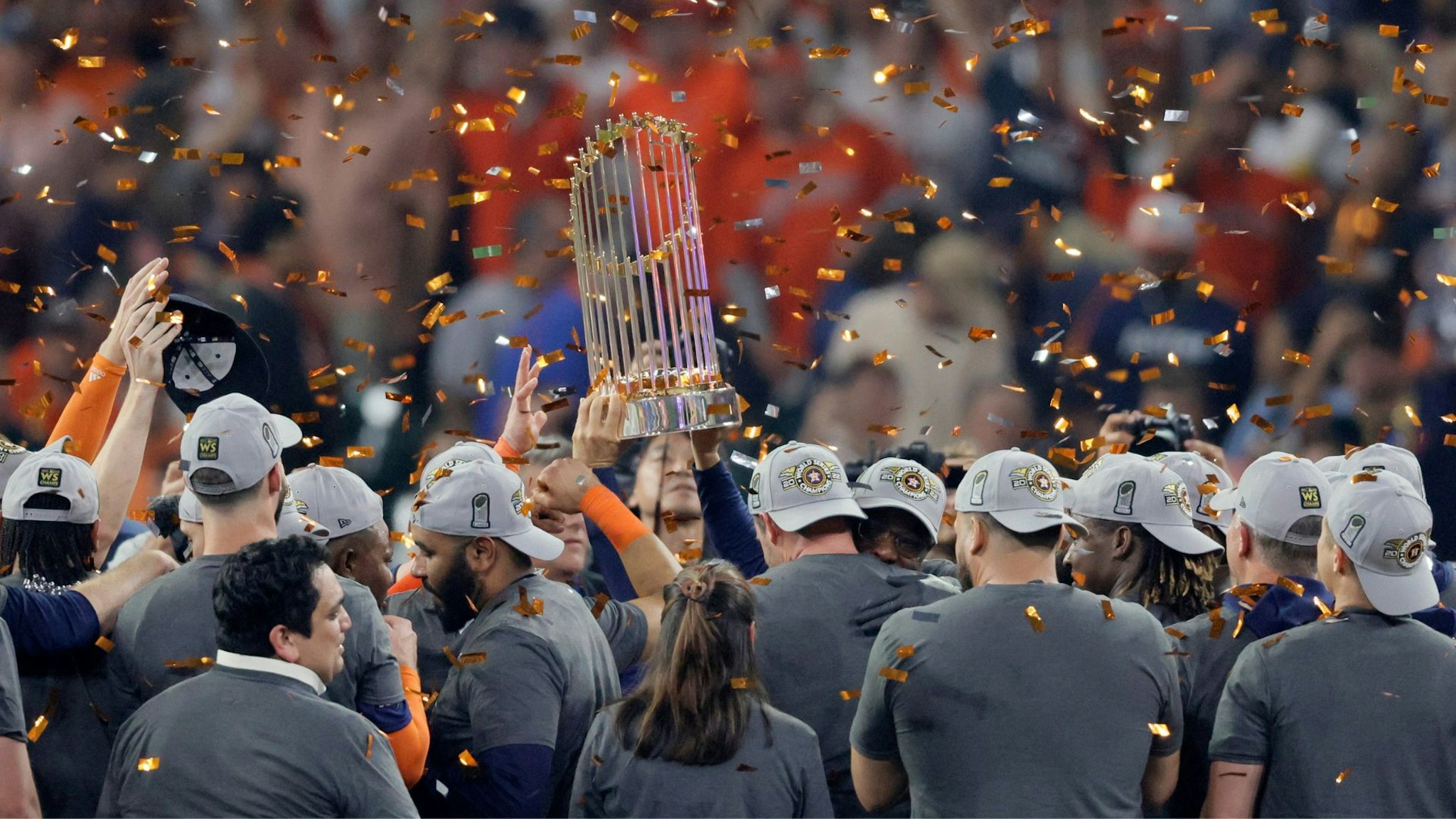 HOUSTON, TEXAS - NOVEMBER 05: The commissioner's trophy is lifted after the Houston Astros defeat the Philadelphia Phillies 4-1 to win the 2022 World Series in Game Six of the 2022 World Series at Minute Maid Park on November 05, 2022 in Houston, Texas.