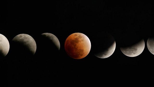 The moon enters and emerges from the earth's shadow during a total eclipse of the moon on February 20, 2008 over in Titusville, Florida in this composite photograph of the stages from partial (L) to total (C) and back to partial (R).