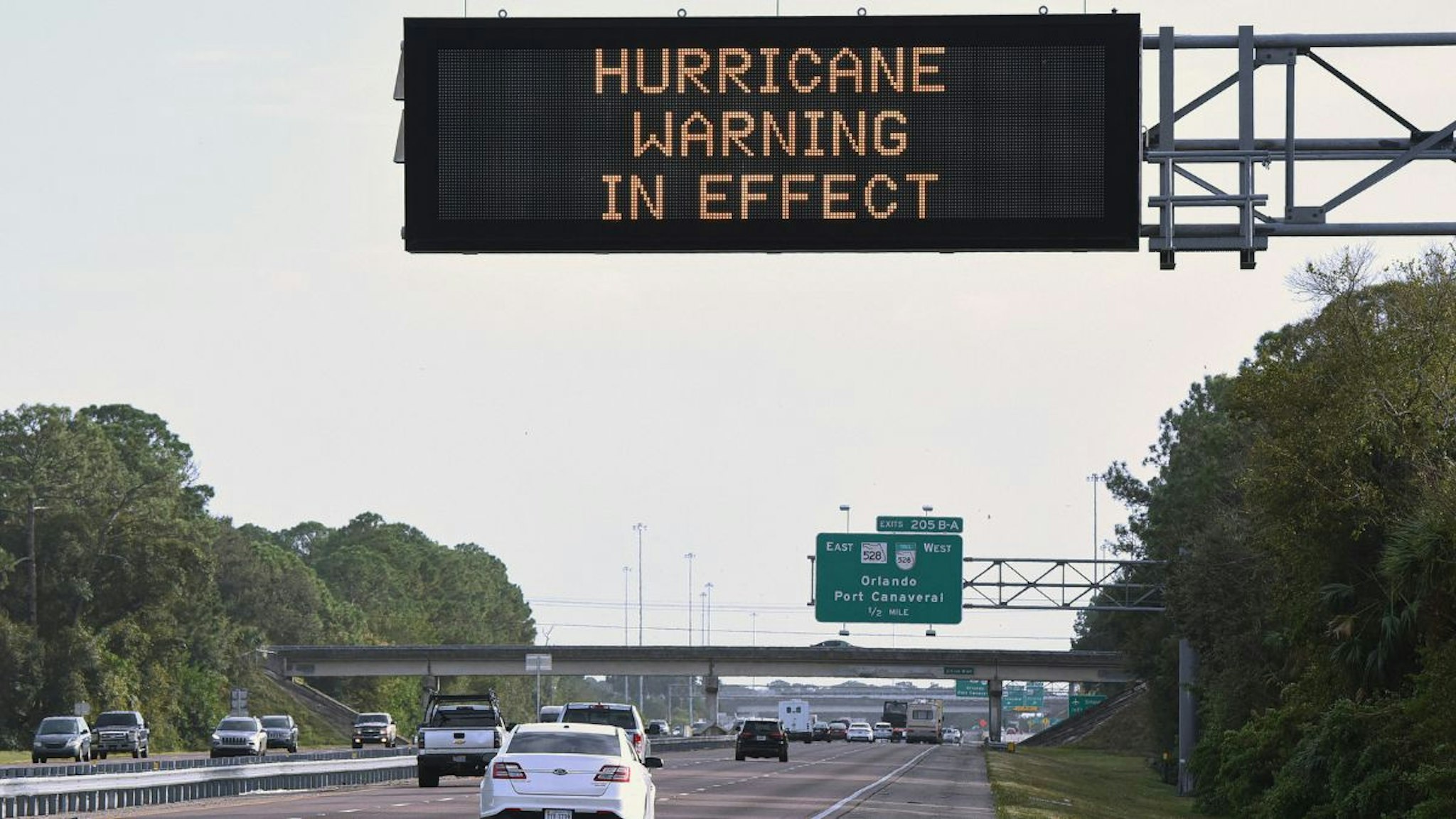 A road sign on I-95 in Cocoa, Florida, advises travelers of a hurricane warning in effect as Tropical Storm Nicole approaches the east coast of Florida.
