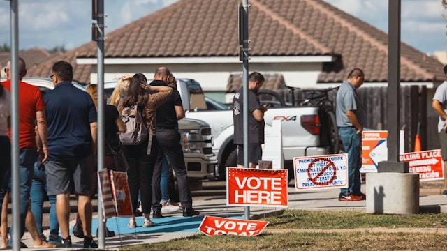 Voters wait in line outside a polling location in McAllen, Texas, US, on Tuesday, Nov. 8, 2022.