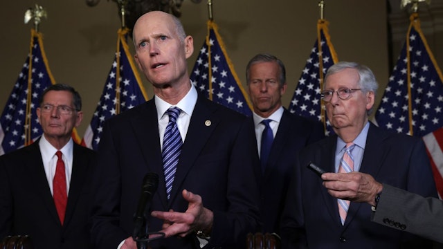 U.S. Sen. Rick Scott (R-FL) speaks to members of the press as Senate Minority Leader Sen. Mitch McConnell (R-KY) (R), Senate Minority Whip Sen. John Thune (R-SD) (3rd L) and Sen. John Barrasso (R-WY) (L) listen after a weekly Republican policy luncheon at the U.S. Capitol September 13, 2022 in Washington, DC.