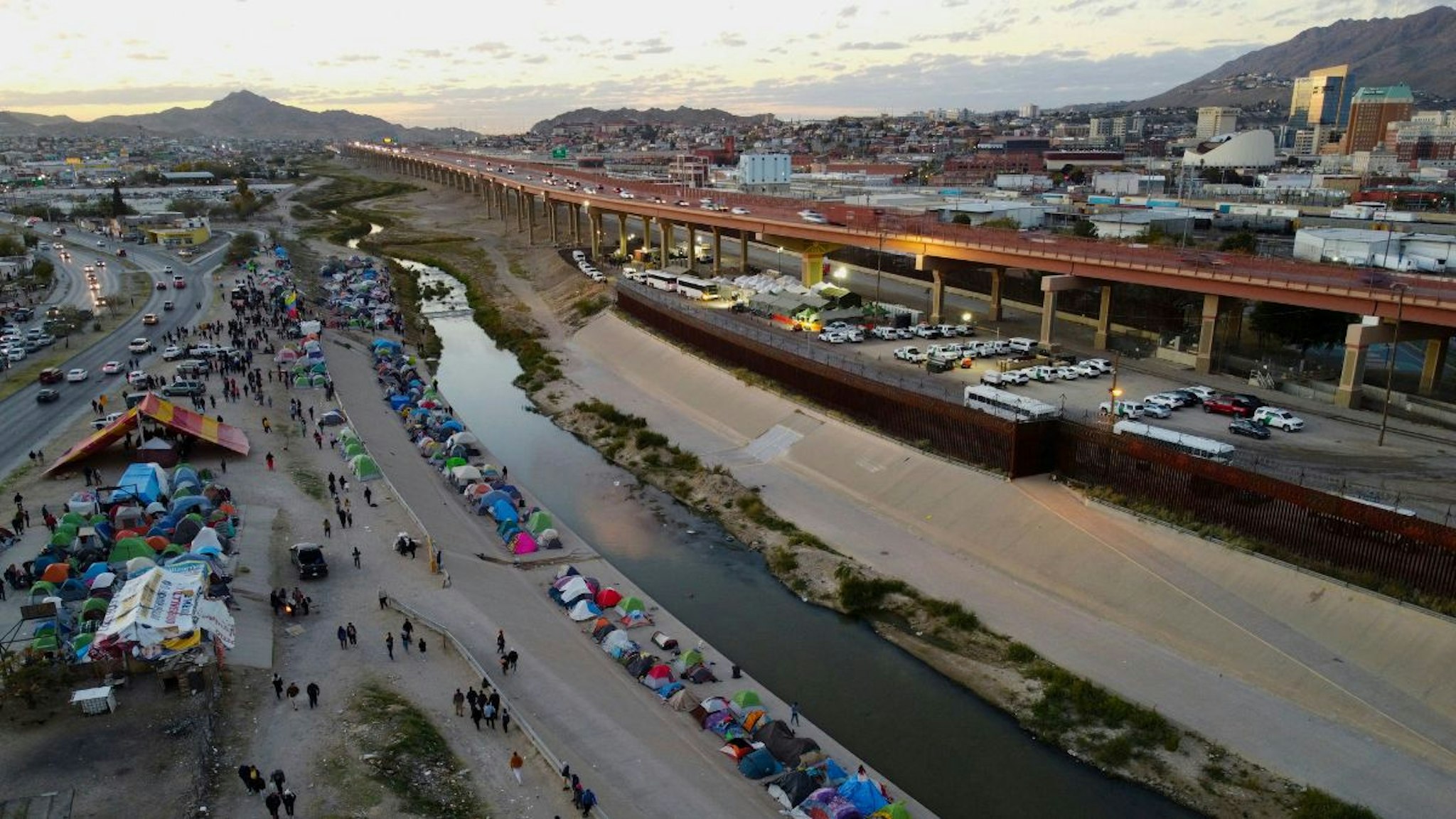 Aerial view of migrants camping on the banks of the Rio Bravo river (or Rio Grande river, as it is called in the US) in Ciudad Juarez, Chihuahua state, Mexico, taken on November 15, 2022.