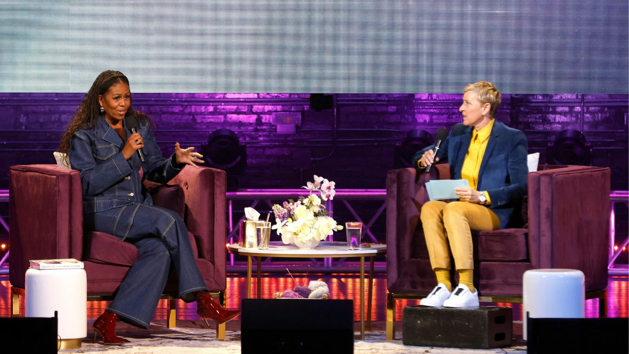WASHINGTON, DC - NOVEMBER 15: Former First Lady Michelle Obama and Ellen DeGeneres speak onstage during the Michelle Obama: The Light We Carry Tour at Warner Theatre on November 15, 2022 in Washington, DC.