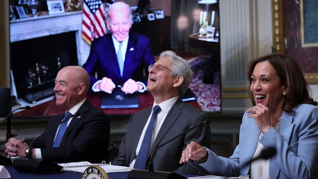 WASHINGTON, DC - AUGUST 03: (L-R) Homeland Security Secretary Alejandro Mayorkas, Attorney General Merrick Garland, and U.S. Vice President Kamala Harris laugh after U.S. President Joe Biden, appearing via teleconference, noted that Harris was speaking while "muted" during a meeting of the Task Force on Reproductive Healthcare Access during an event at the White House complex August 3, 2022 in Washington, DC. Abortion rights advocates achieved a victory yesterday in Kansas when voters rejected a proposed constitutional amendment that would have allowed state legislators to ban or significantly restrict abortion.