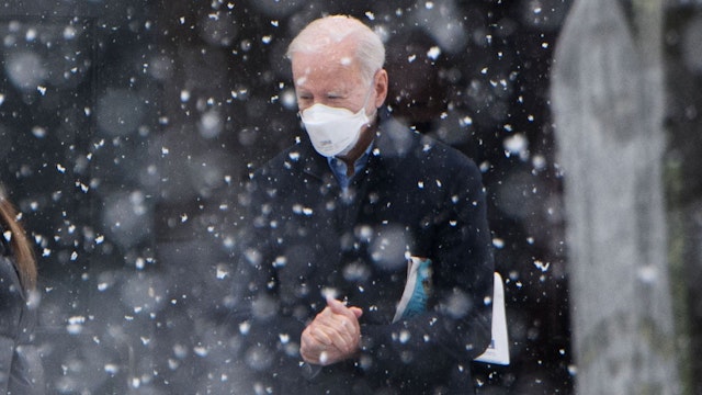 TOPSHOT - US President Joe Biden makes his way to his vehicle in the snow, after attending Mass at Saint Joseph on the Brandywine Church in Wilmington, Delaware on February 7, 2021. - President Joe Biden anticipates the US rivalry with China will take the form of "extreme competition" rather than conflict between the two world powers. Biden said in a CBS interview aired Sunday that he has not spoken with Chinese counterpart Xi Jinping since he became US president.