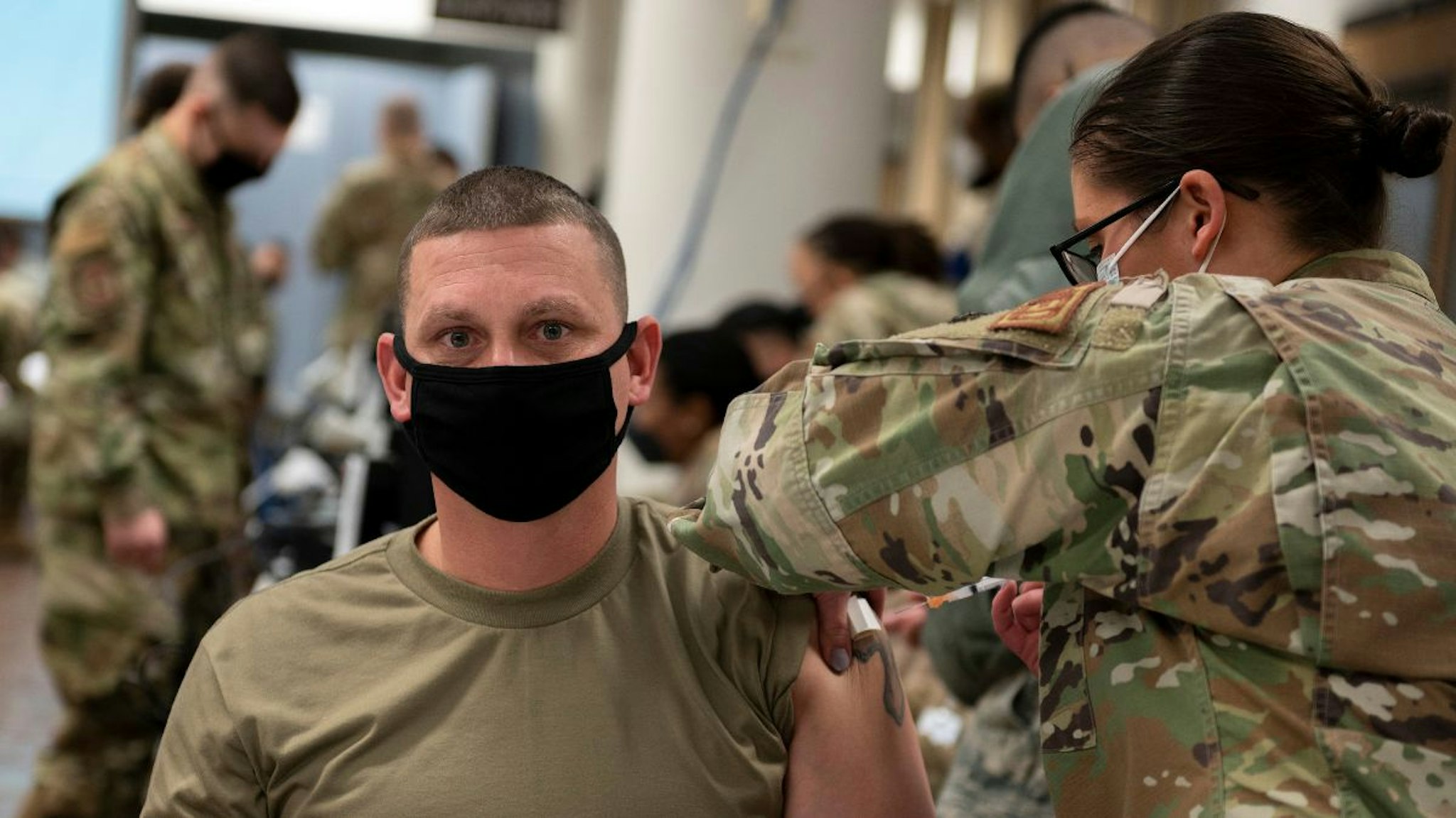 In this handout image provided by United States Forces Korea, U.S. Air Force Sgt. Gerald Allen receives a dose of the Moderna COVID-19 vaccine at Osan Air Base on December 29, 2020 in Pyeongtaek, South Korea.