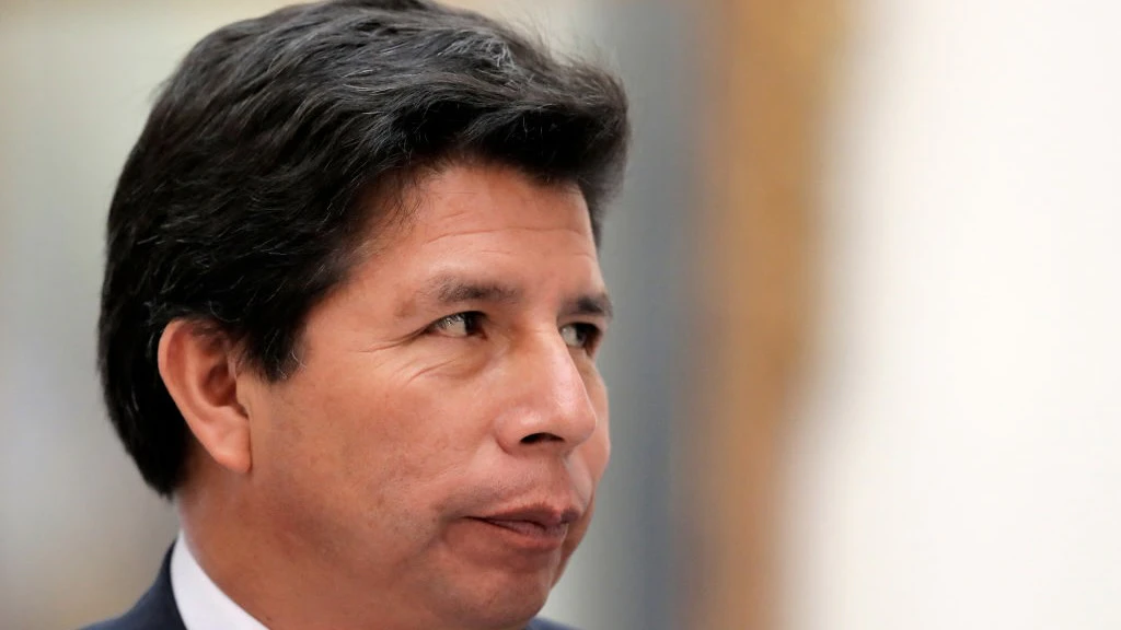 CHILE-PERU-POLITICS-BORIC-CASTILLO Peru's President Pedro Castillo gestures during a press conference with his Chilean counterpart Gabriel Boric (out of frame) at La Moneda presidential palace in Santiago, on November 29, 2022, during his visit to Chile. (Photo by JAVIER TORRES / AFP) (Photo by JAVIER TORRES/AFP via Getty Images) JAVIER TORRES / Contributor