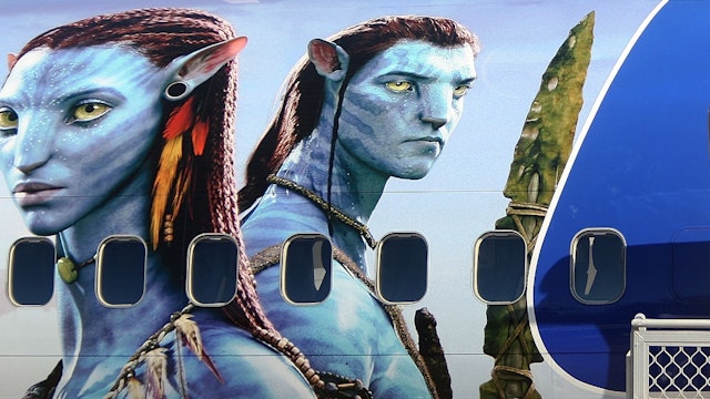 Models dressed up as characters from the film 'Avatar' depart a branded plane during the launch of "AVATAR" Blu-ray and DVD at Sydney Domestic Airport on April 29, 2010 in Sydney, Australia.
