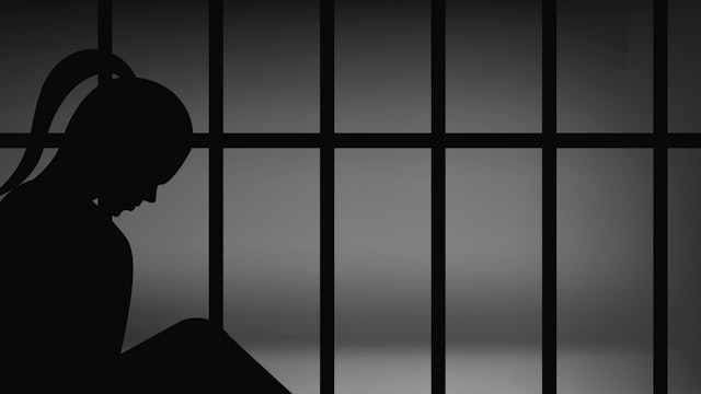 Vector female in prison - stock illustration eps10 vector female in prison, illustration silhouette woman in jail ojoel via Getty Images