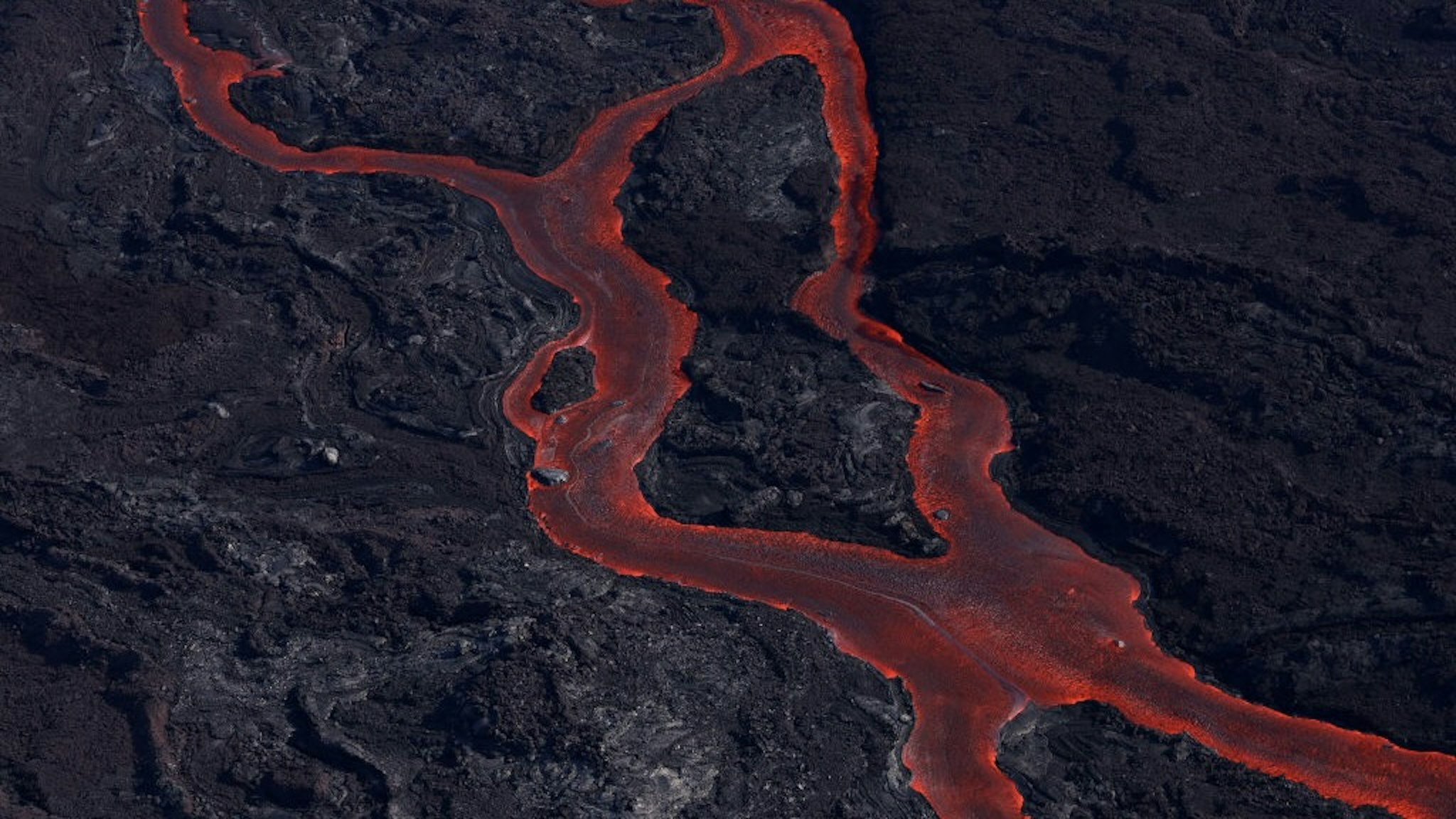 Mauna Loa Volcano Erupts On Big Island Of Hawaii HILO, HAWAII - DECEMBER 05: In an aerial view, lava flows from a fissure of Mauna Loa Volcano as it erupts on December 05, 2022 in Hilo, Hawaii. For the first time in nearly 40 years, the Mauna Loa volcano, the largest active volcano in the world, has erupted. (Photo by Justin Sullivan/Getty Images) Justin Sullivan / Staff