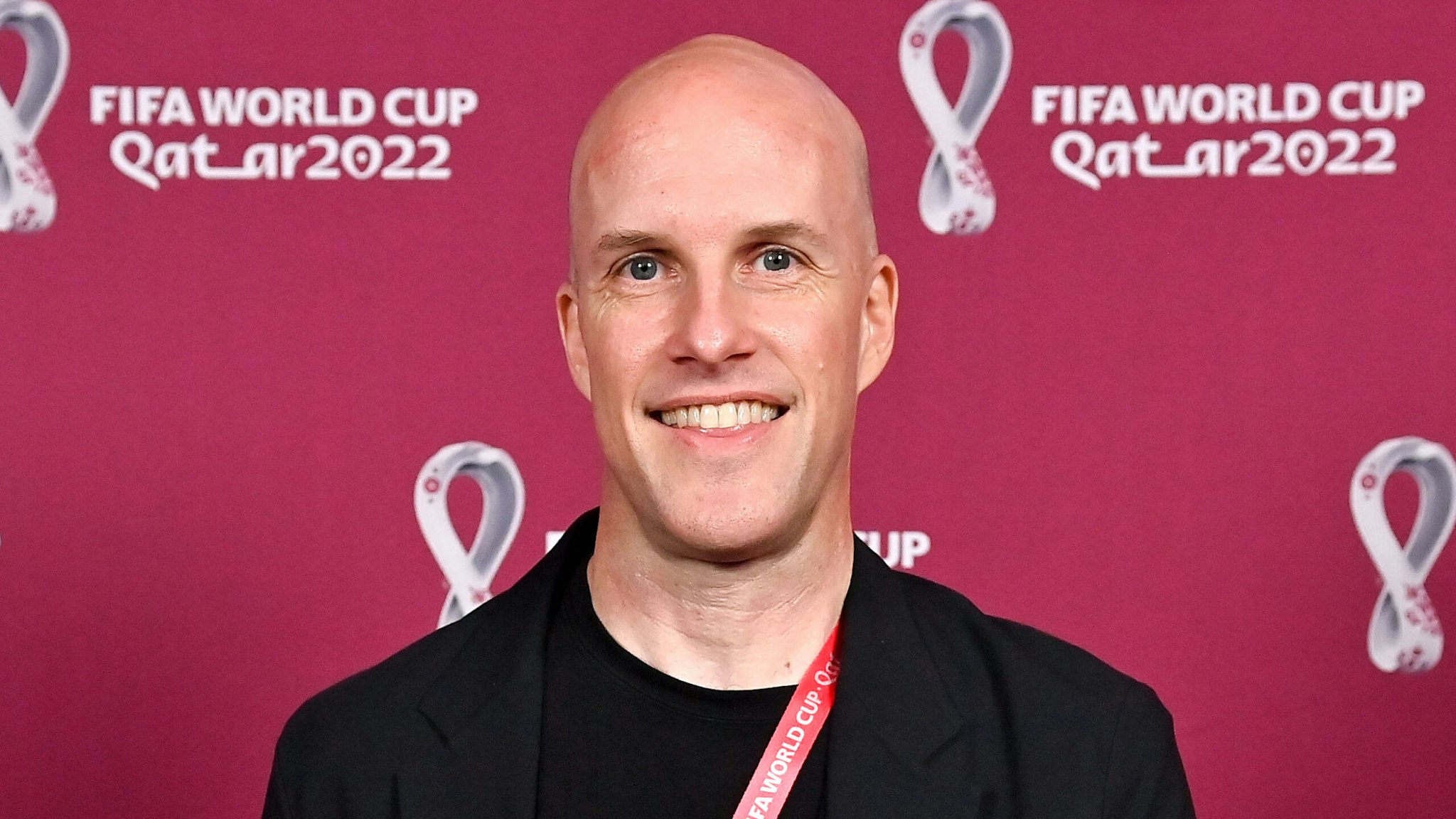 DOHA, QATAR - NOVEMBER 26: Grant Wahl with a world cup replica trophy, in recognition of their achievement of covering 8 or more FIFA World Cups, during an AIPS / FIFA Journalist on the Podium ceremony at the Main Media Centre on November 29, 2022 in Doha, Qatar.