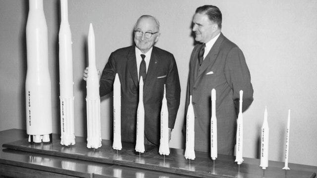 NASA Administrator James E Webb presents a collection of rocket models to President Harry S Truman during a presidential visit to the newly opened NASA Headquarters in Washington, District of Columbia, November 3, 1961.