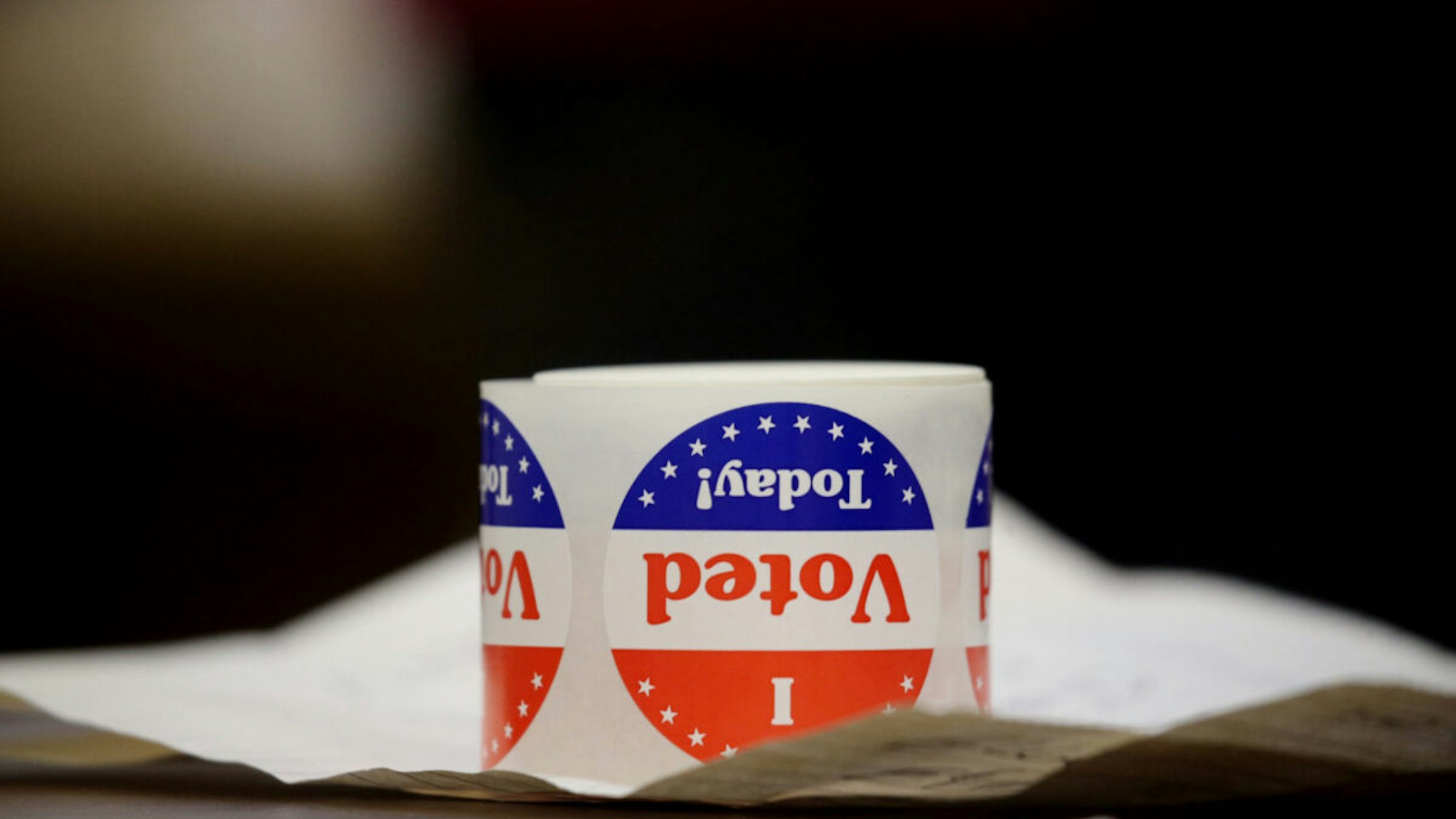 Stickers sit on a table at Saint John the Baptist Parish in Quincy, MA on election day, November 03, 2020.