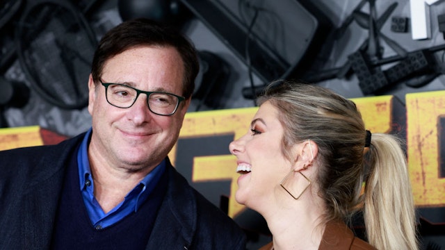 US actor Bob Saget (L) and wife Kelly Rizzo attend the "MacGruber" screening and premiere at the California Science Center on December 8, 2021 in Los Angeles. (Photo by Michael Tran / AFP) (Photo by MICHAEL TRAN/AFP via Getty Images)