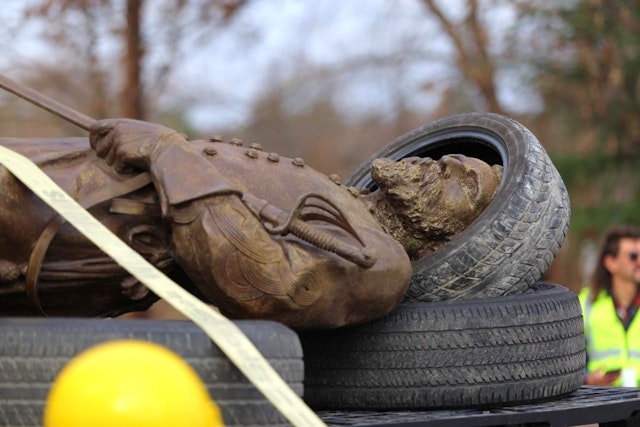 RICHMOND, VA - DEC 12: The statue of Confederate General A.P. Hill rests on a trailer after it was removed from its pedestal in Richmond, Virginia on December 12, 2022. Hill's remains are buried under the memorial and will be relocated.