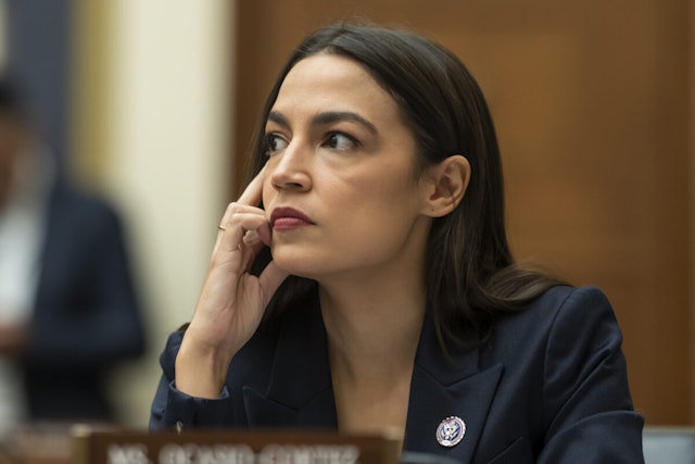 Rep. Alexandria Ocasio-Cortez (D-NY) listens as John J. Ray III, CEO of FTX Group, testifies during the House Financial Services Committee hearing titled Investigating the Collapse of FTX Part I, at the US Capitol on December 13, 2022 in Washington, DC.