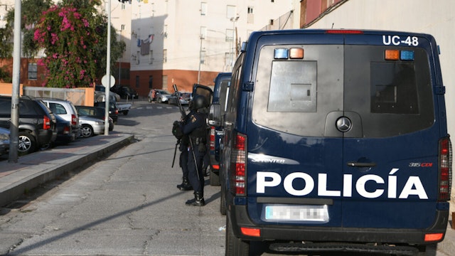 A van and National Police officers during a police operation in the neighborhood of El Principe de Ceuta, on 10 October, 2022 in Ceuta, Spain.