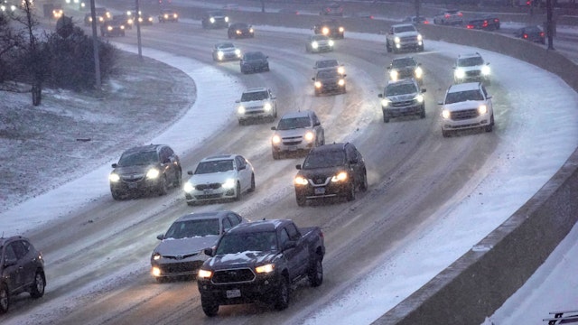 CHICAGO, ILLINOIS - DECEMBER 22: Commuters navigate a snow-covered Kennedy Expressway during a lighter-than-ussual evening rush hour as temperatures hang in the single-digits on December 22, 2022 in Chicago, Illinois. A winter weather system bringing snow, high winds, and sub-zero temperatures has wreaked havoc on a large section of the county in front of the holidays. Strong winds are expected to combine with sub-zero temperatures tomorrow driving the wind chill in Chicago to around -40 degrees. (Photo by Scott Olson/Getty Images)