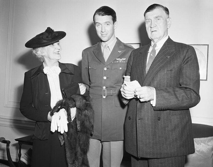 (Original Caption) 9/1/1945-New York, New York-Just like any serviceman returning from the war, Colonel James Stewart was greeted by his proud parents, who journeyed from Indiana, PA, to see their son after his arrival aboard the Queen Elizabeth. A veteran of a year and a half overseas with the 8th Air Force, Colonel Stewart, in his last command, was senior officer over approximately 9,000 men. Here he is shown with his parents at the St. Regis Hotel.