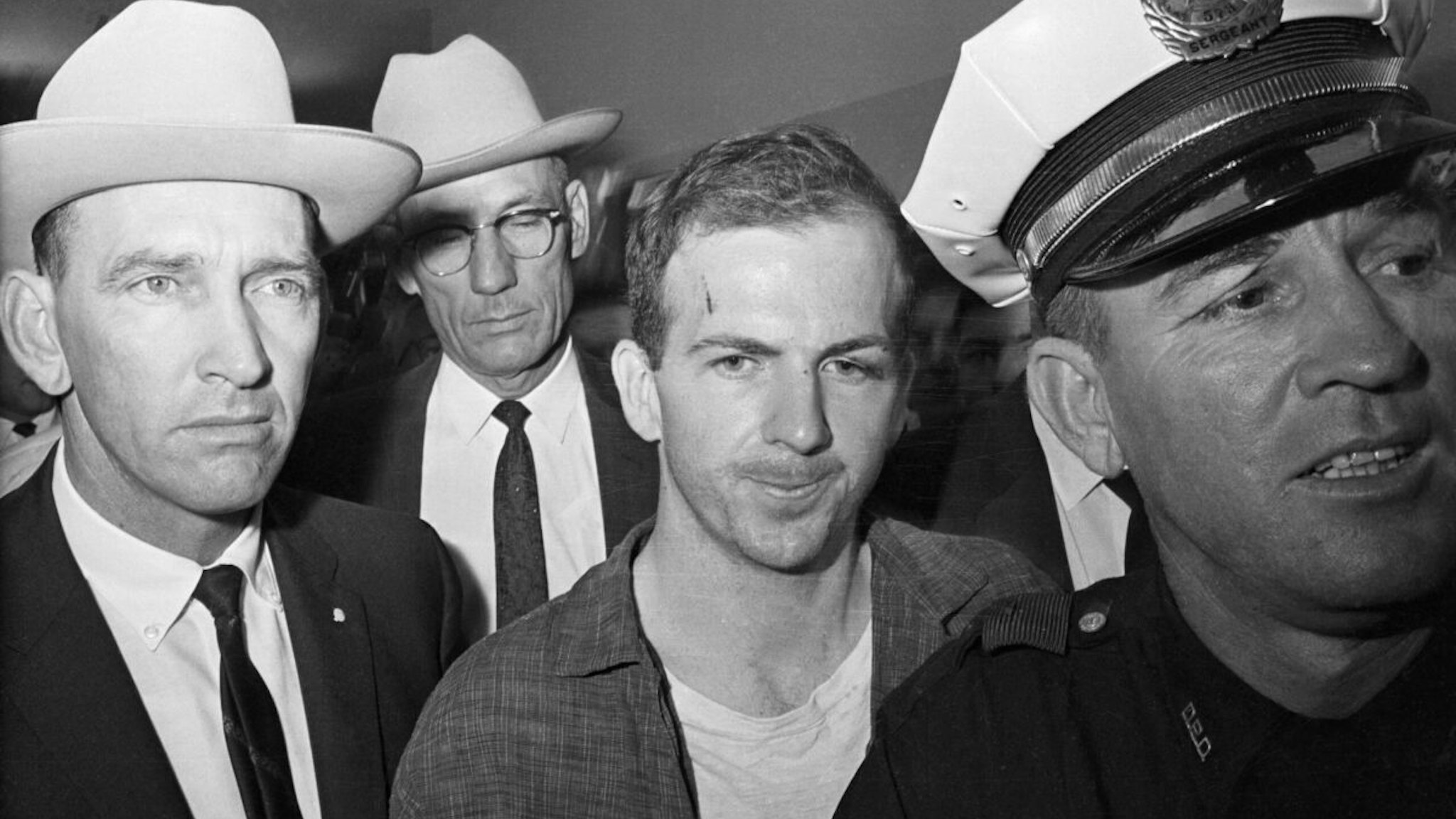 ) Twenty-four-year-old ex-marine Lee Harvey Oswald is shown after his arrest here on November 22.