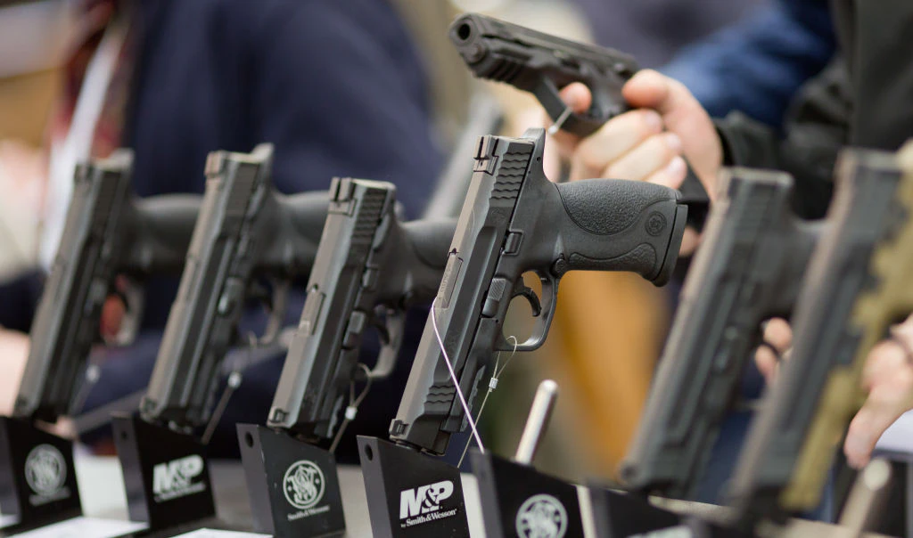 Handguns from US American arms manufacturer Smith &amp; Wesson (S&amp;W) at the comapany's stand at the IWA OutdoorClassics hunting and sporting weapons fair in Nuremberg, Germany, 05 March 2016. Photo: DANIEL KARMANN/dpa | usage worldwide (Photo by Daniel Karmann/picture alliance via Getty Images)