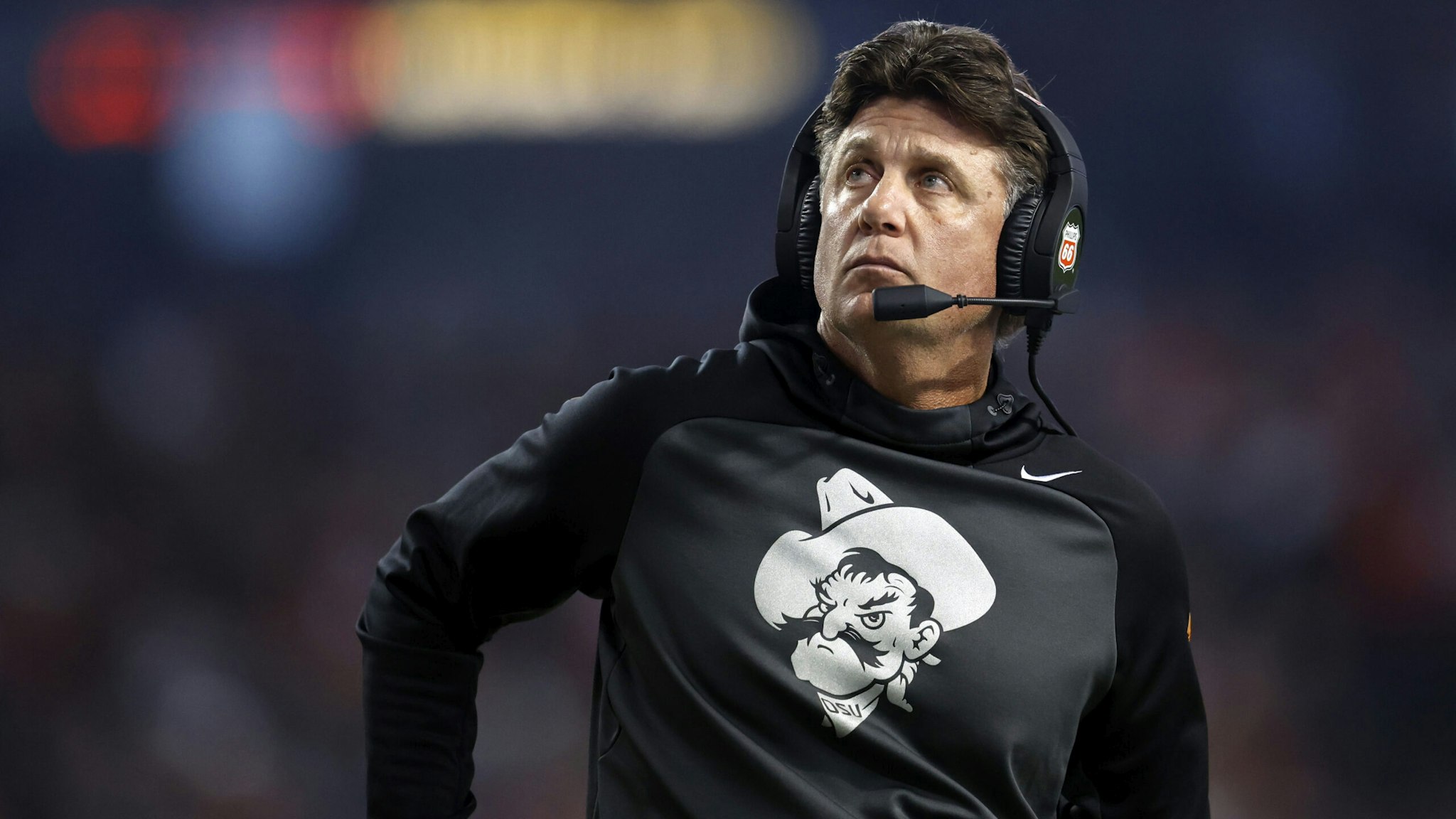 PHOENIX, ARIZONA - DECEMBER 27: Head coach Mike Gundy of the Oklahoma State Cowboys looks on during the first half of the Guaranteed Rate Bowl against the Wisconsin Badgers at Chase Field on December 27, 2022 in Phoenix, Arizona.