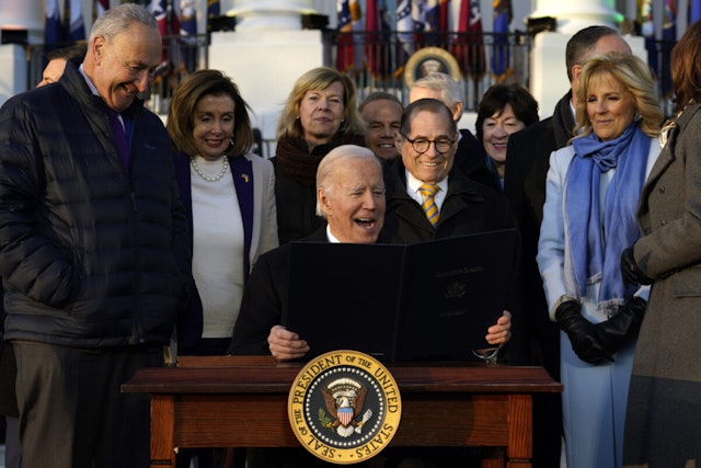US President Joe Biden, center, after signing H.R. 8408, the Respect for Marriage Act, during a ceremony on the South Lawn of the White House in Washington, DC, US, on Tuesday, Dec. 13, 2022. Passage of the bill is a victory for Democrats who had raised concerns that the US Supreme Court could next reverse rights for same-sex couples after it overturned the Roe v. Wade decision that established the constitutional right to an abortion.