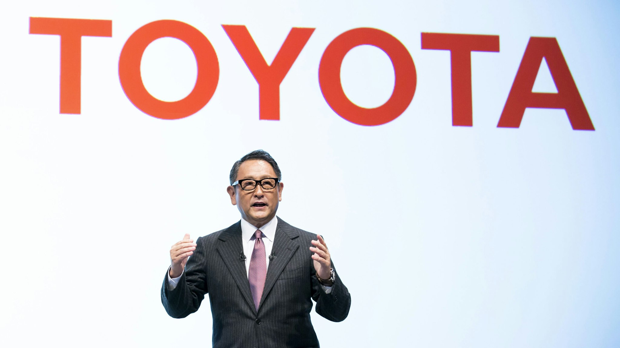 TOKYO, JAPAN - OCTOBER 04: Toyota Motor Corp. President Akio Toyoda speaks during a joint press conference with SoftBank Group Corp. on October 4, 2018 in Tokyo, Japan. Softbank and Toyota announced today their partnership to establish a joint venture for new mobility services.