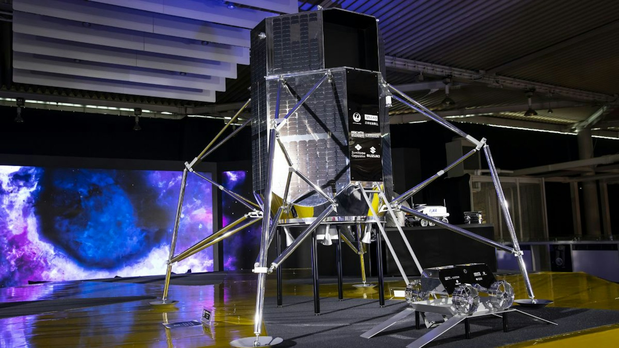 A full-scale model of ispace Inc.'s lunar lander and lunar rover HAKUTO-R sit on display during the media day of the Tokyo Motor Show in Tokyo, Japan, on Wednesday, Oct. 23, 2019.