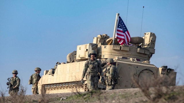 US forces patrol the countryside of Rumaylan (Rmeilan) in Syria's northeastern Hasakeh province near the border with Turkey, on December 4, 2022.