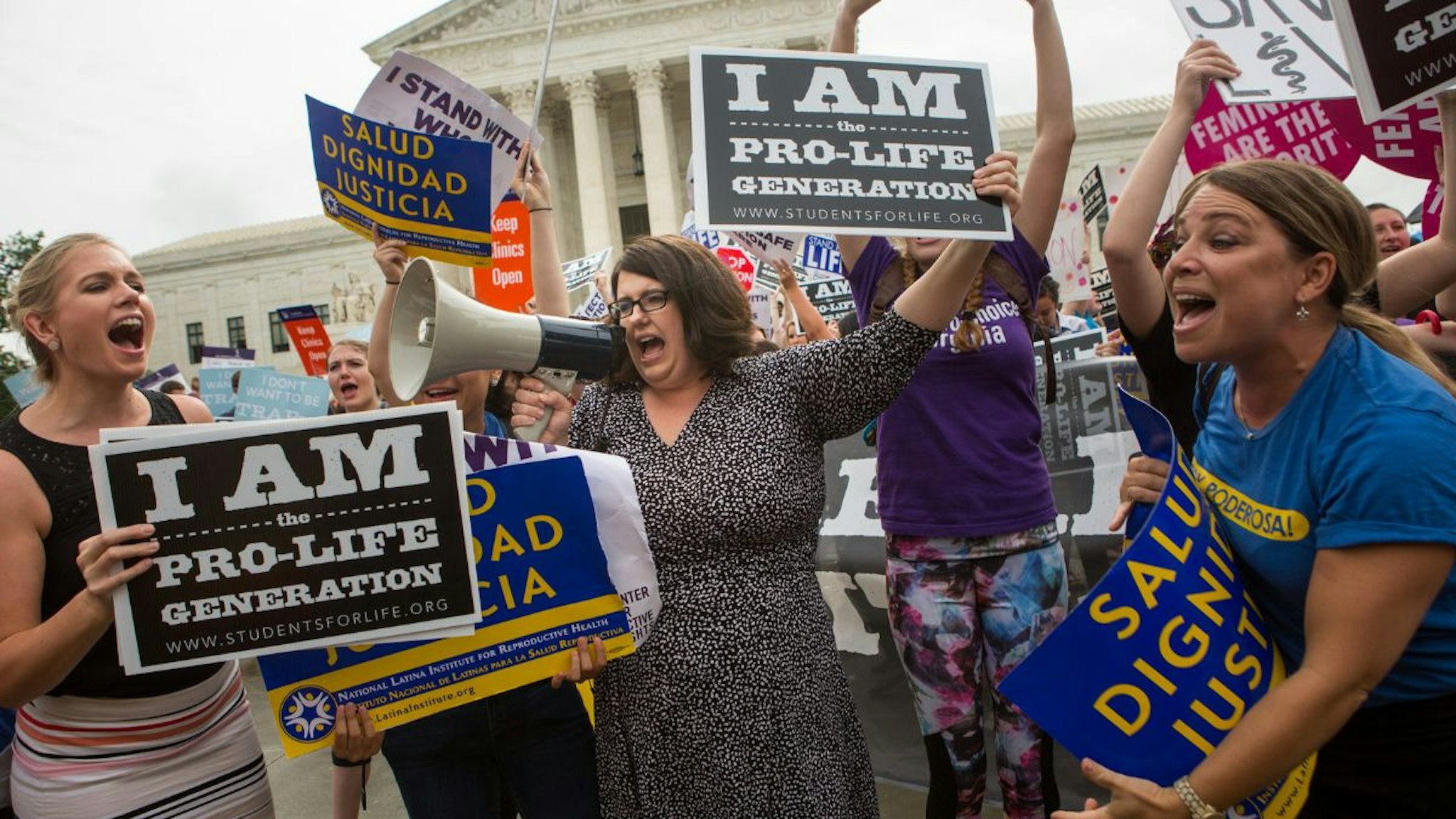 Kristan Hawkins, president of Students for Life, center, and other pro-life protesters clash with pro-choice protesters in front of the U.S. Supreme Court on a day where two important decisions on immigration and affirmative action were handed down by the court, on June 23, 2016 in Washington, DC.