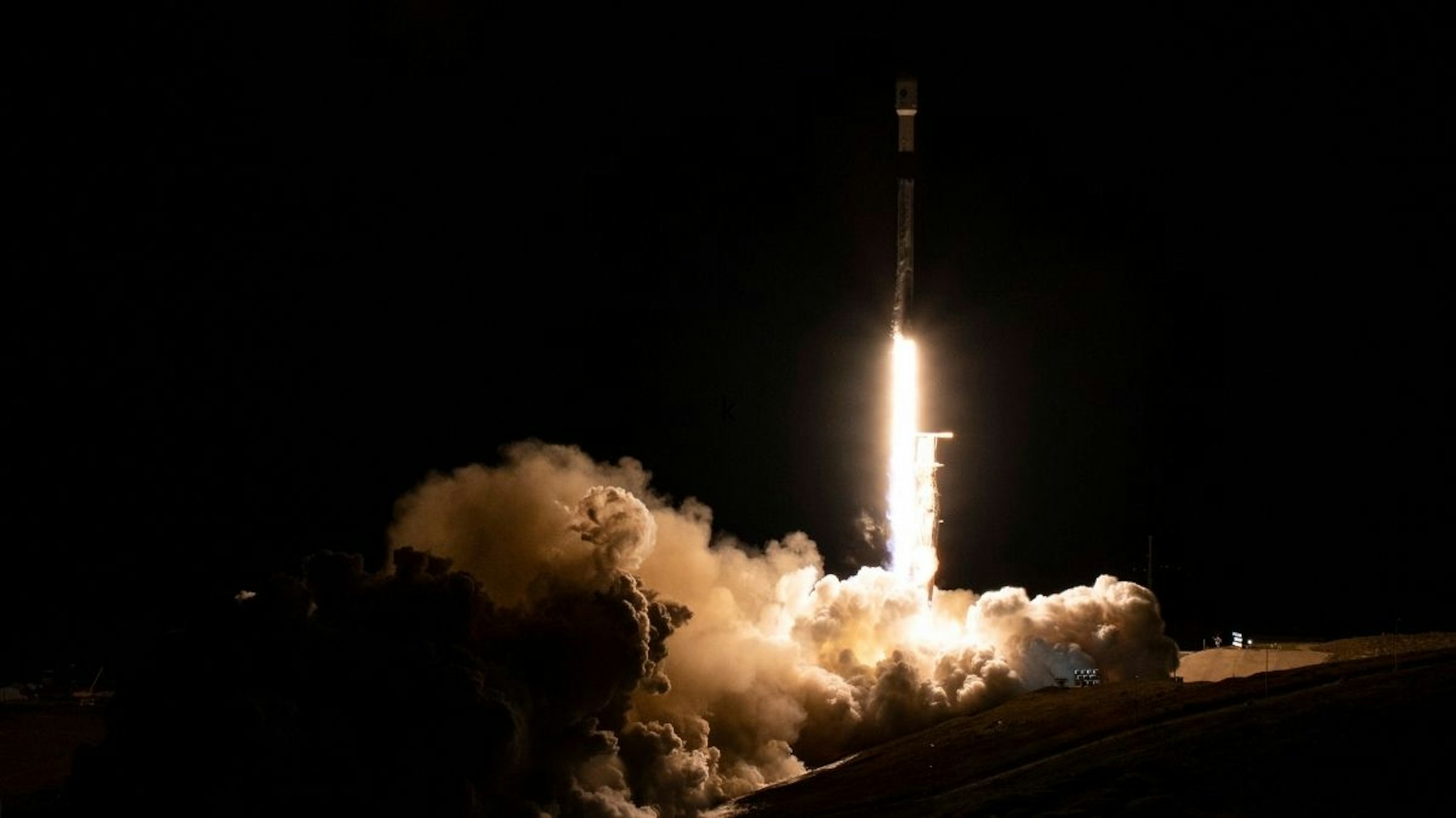 A SpaceX Falcon 9 rocket launches with the Surface Water and Ocean Topography (SWOT) spacecraft onboard, on December 16, 2022, from Space Launch Complex 4E at Vandenberg Space Force Base in Lompoc, California.