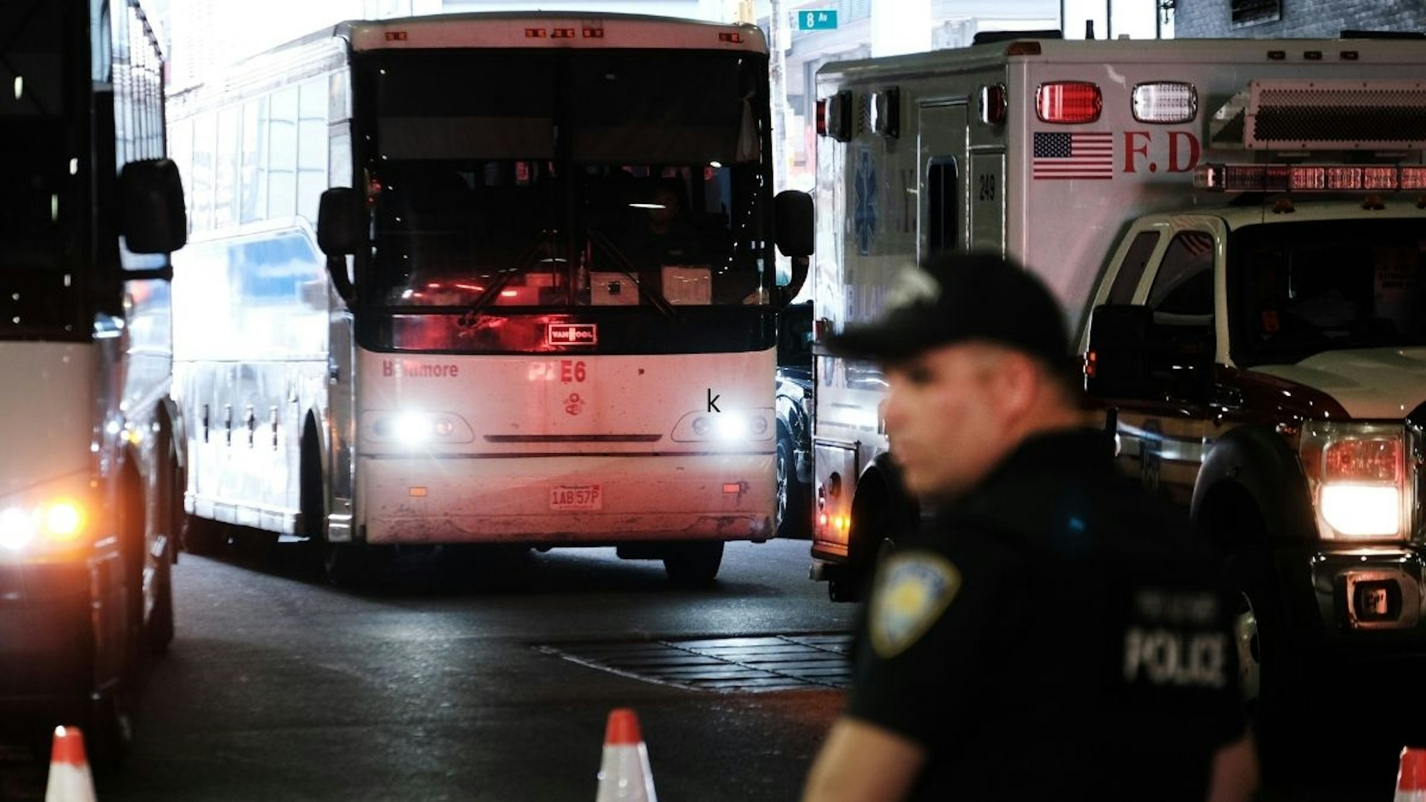 A bus carrying migrants who crossed the border from Mexico into Texas arrives into the Port Authority bus station in Manhattan on August 25, 2022 in New York City.