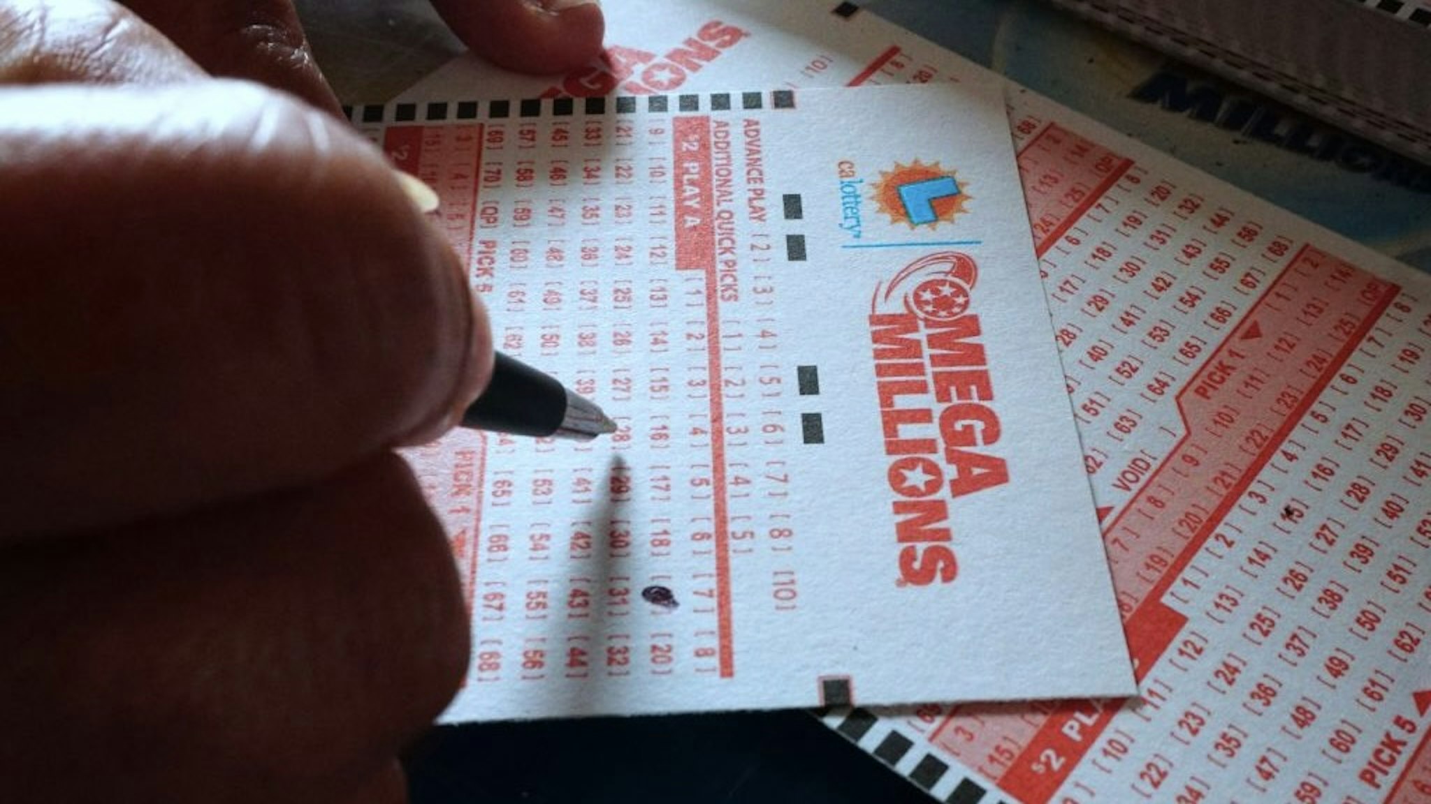 US-LIFESTYLE-LOTTERY Numbers are selected on a Mega Millions lottery ticket in Los Angeles, California on October 23, 2018. - The Mega Millions jackpot, now reaching 1.6 billion USD, will be drawn on tonight. (Photo by Frederic J. BROWN / AFP) (Photo credit should read FREDERIC J. BROWN/AFP via Getty Images) FREDERIC J. BROWN / Contributor