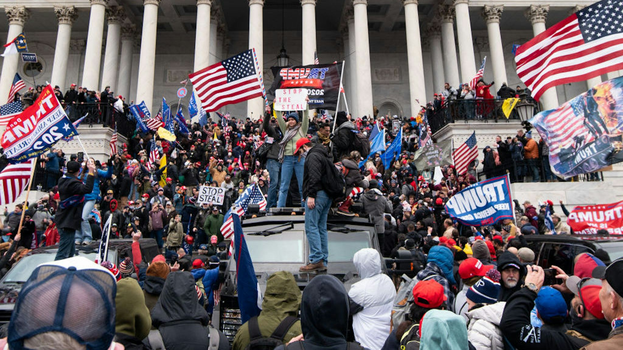 UNITED STATES - JANUARY 6: Trump flags fly as rioters take over the steps of the Capitol on the East Front on Wednesday, Jan. 6, 2021, as the Congress works to certify the electoral college votes. (Photo By Bill Clark/CQ-Roll Call, Inc via Getty Images)