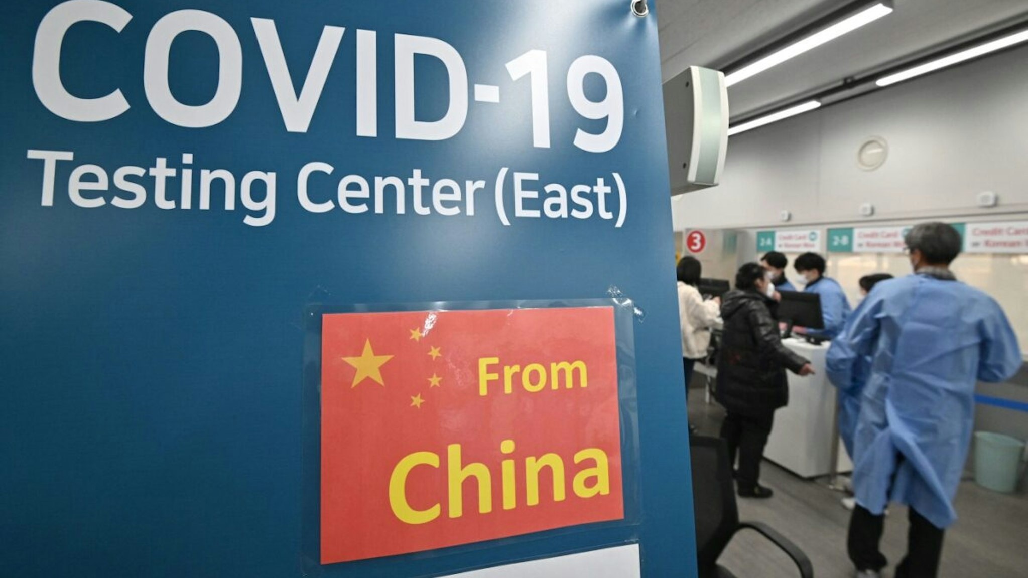 Health workers guide travellers arriving from China at a Covid-19 testing centre at Incheon International Airport, west of Seoul on January 3, 2023.