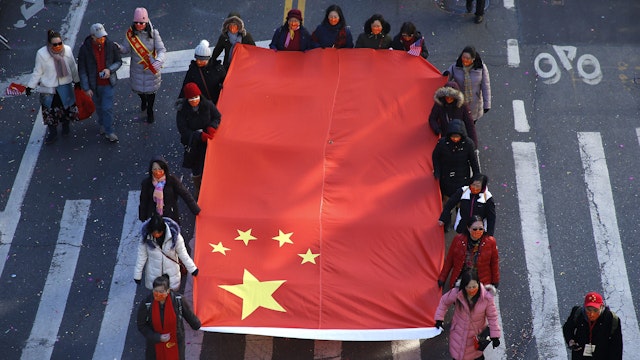 NEW YORK, NEW YORK - FEBRUARY 20: Participants march in the Chinatown Lunar New Year Parade on February 20, 2022 in New York City.
