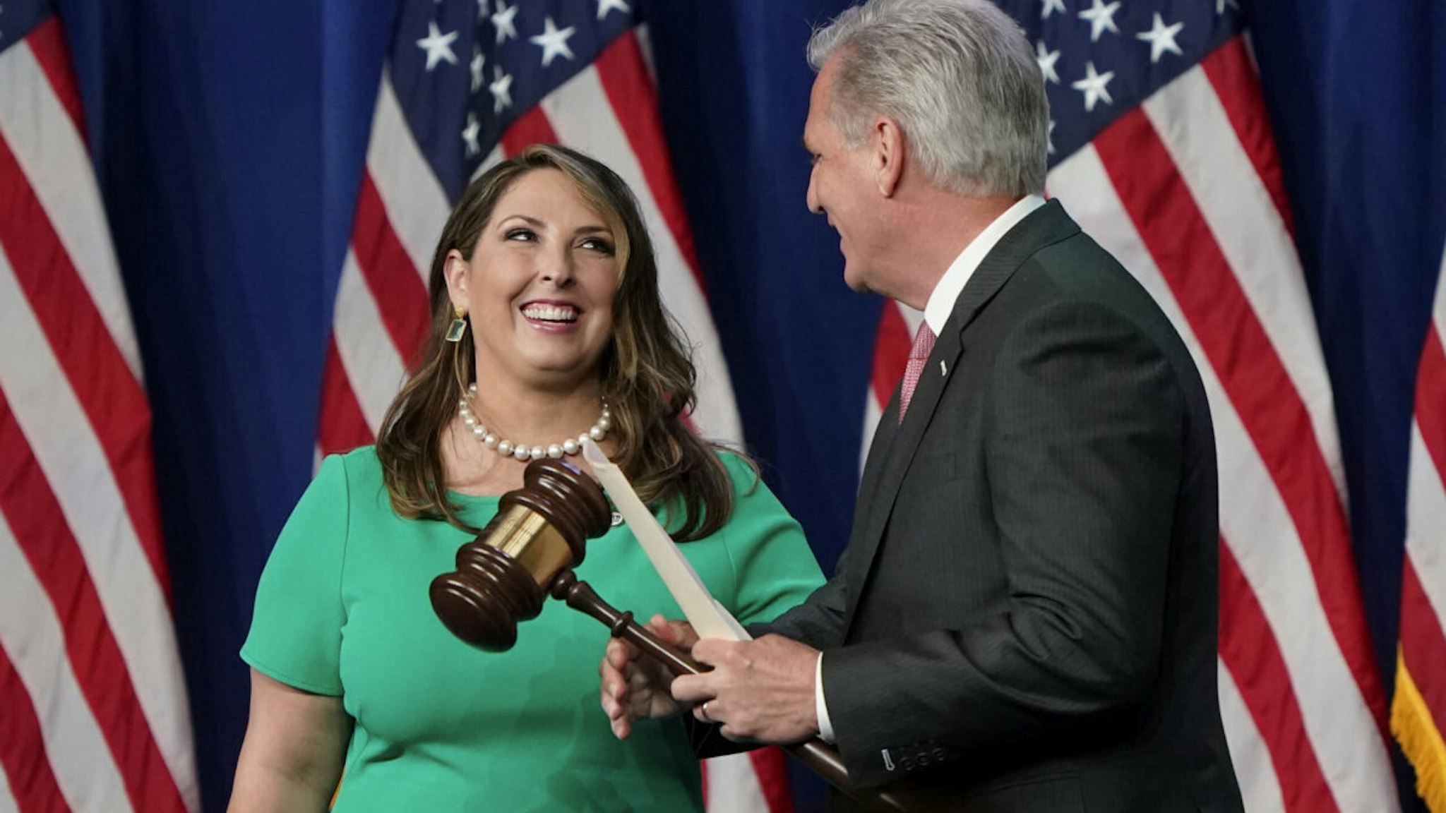 Republican National Committee Chairwoman, Ronna McDaniel, hands the gavel to House Minority Leader Kevin McCarthy of California, before he speaks at the opening of the first day of the Republican National Convention, meeting in the Richardson Ballroom, Charlotte Convention Center on August 24, 2020, in Charlotte, North Carolina, for the roll call vote to renominate Donald Trump to be President of the United States and Mike Pence to be Vice President.