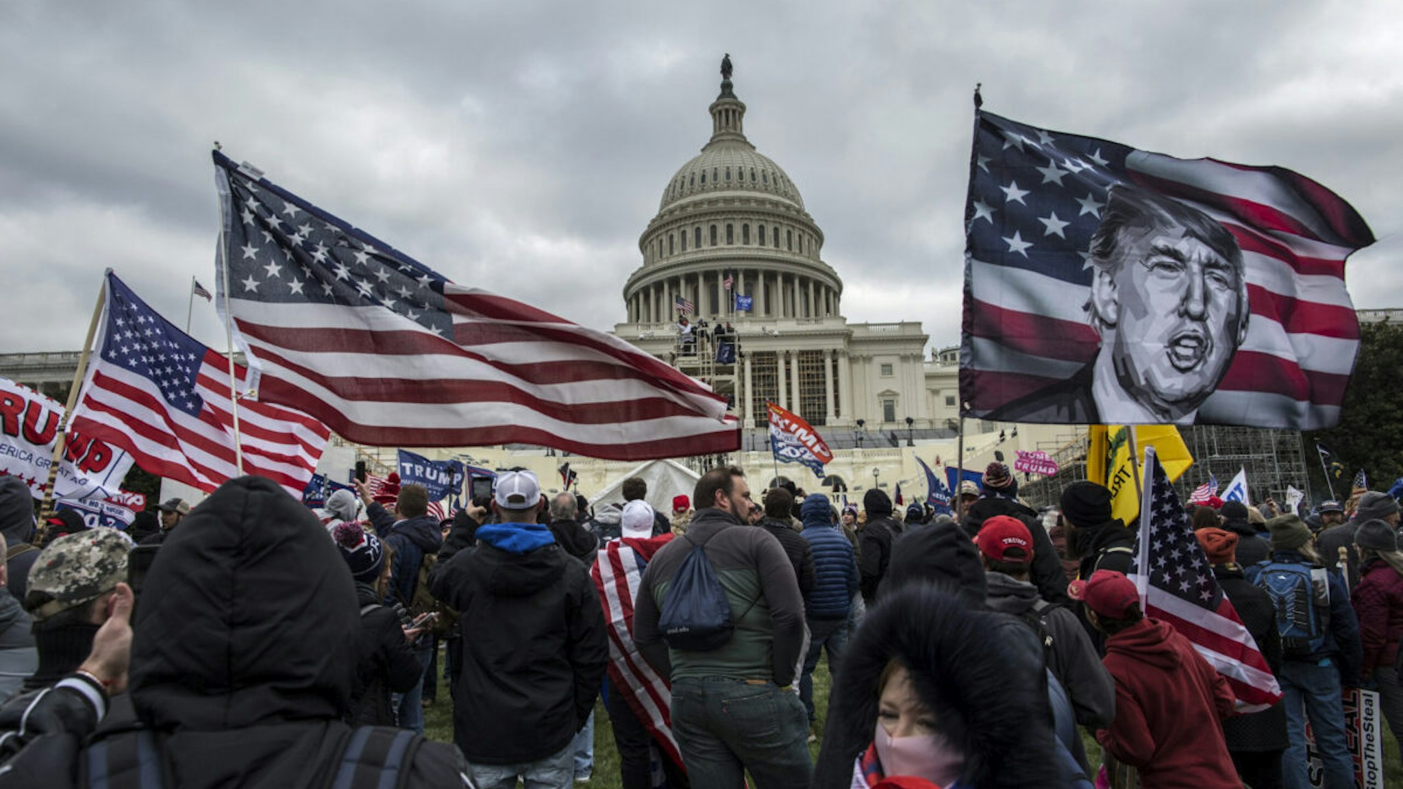 US President Donald Trump's supporters gather outside the Capitol building. Pro-Trump rioters stormed the US Capitol as lawmakers were set to sign off Wednesday on President-elect Joe Biden's electoral victory in what was supposed to be a routine process headed to Inauguration Day.