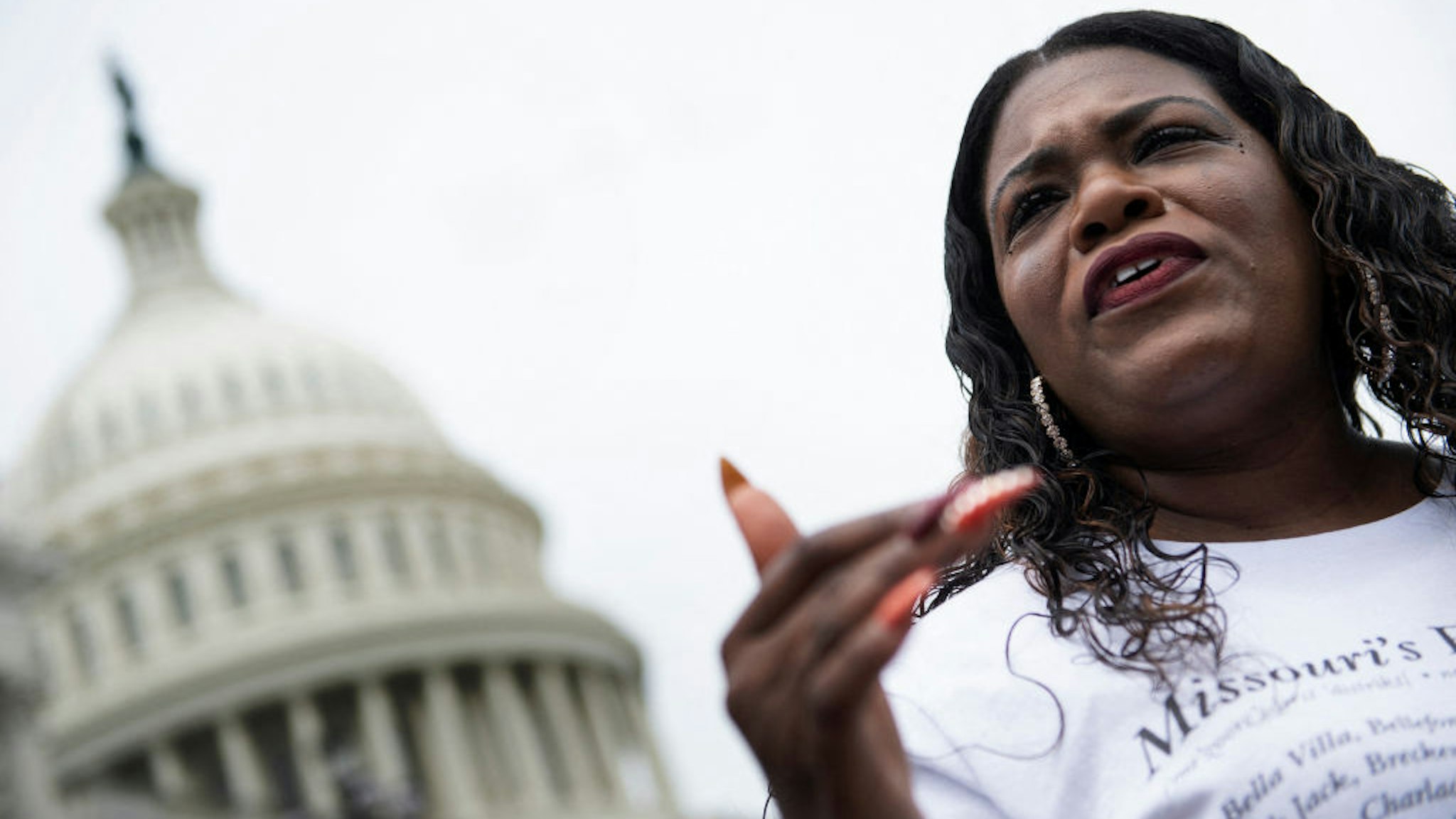Rep. Cori Bush (D-MO) speaks to the press as people continue to gather on Capitol Hill to protest the end of the eviction moratorium on August 3, 2021, in Washington, DC. - Rep. Bush has been camping out at the front steps of the US Capitol to protest the ending of the eviction moratorium.The White House has instructed government agencies to do what they can to prevent evictions in properties in federal programs or with federal loan guarantees. (Photo by Brendan Smialowski / AFP) (Photo by BRENDAN SMIALOWSKI/AFP via Getty Images)