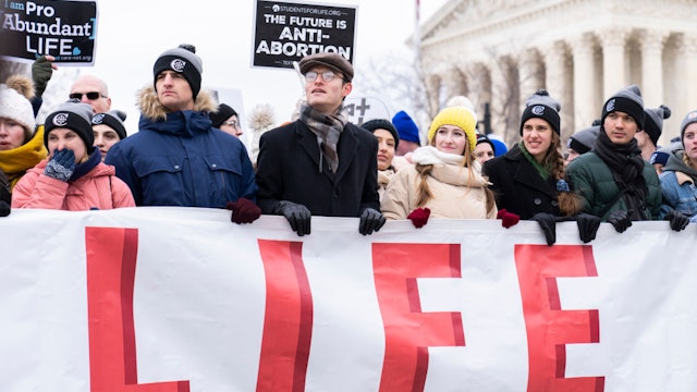 UNITED STATES - JANUARY 21: Demonstrators walk on First Street during the annual 49th March for Life anti-abortion demonstration on Capitol Hill in Friday, January 21, 2022.