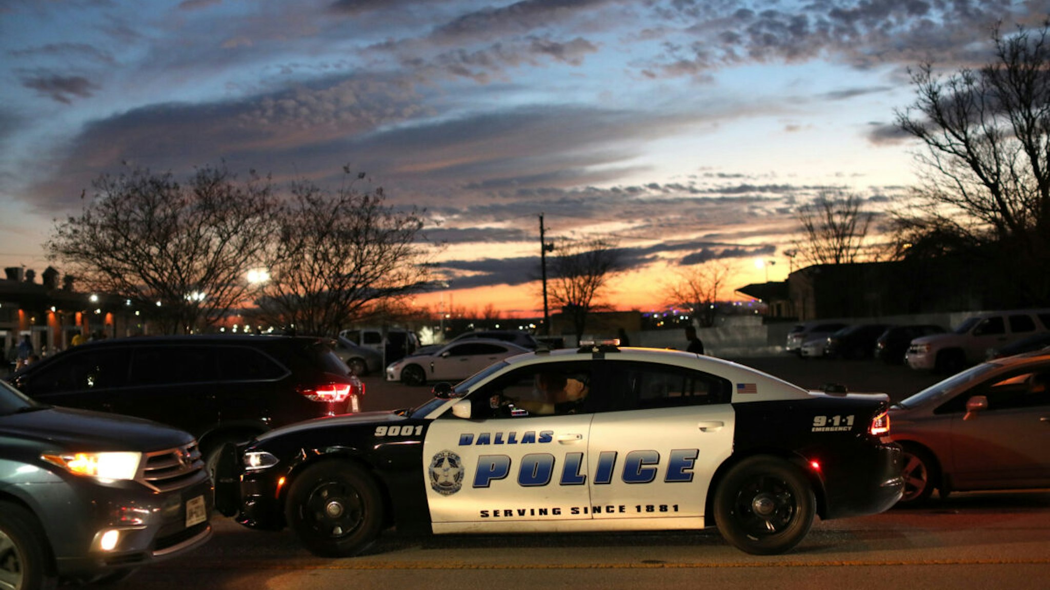 A Dallas Police Department vehicle patrols an area in Dallas, Texas, U.S., on Tuesday, Feb. 1, 2022. As other major U.S. cities double down on policing in response to an increase in homicides and violent crime, Dallas officials are taking a different approach.