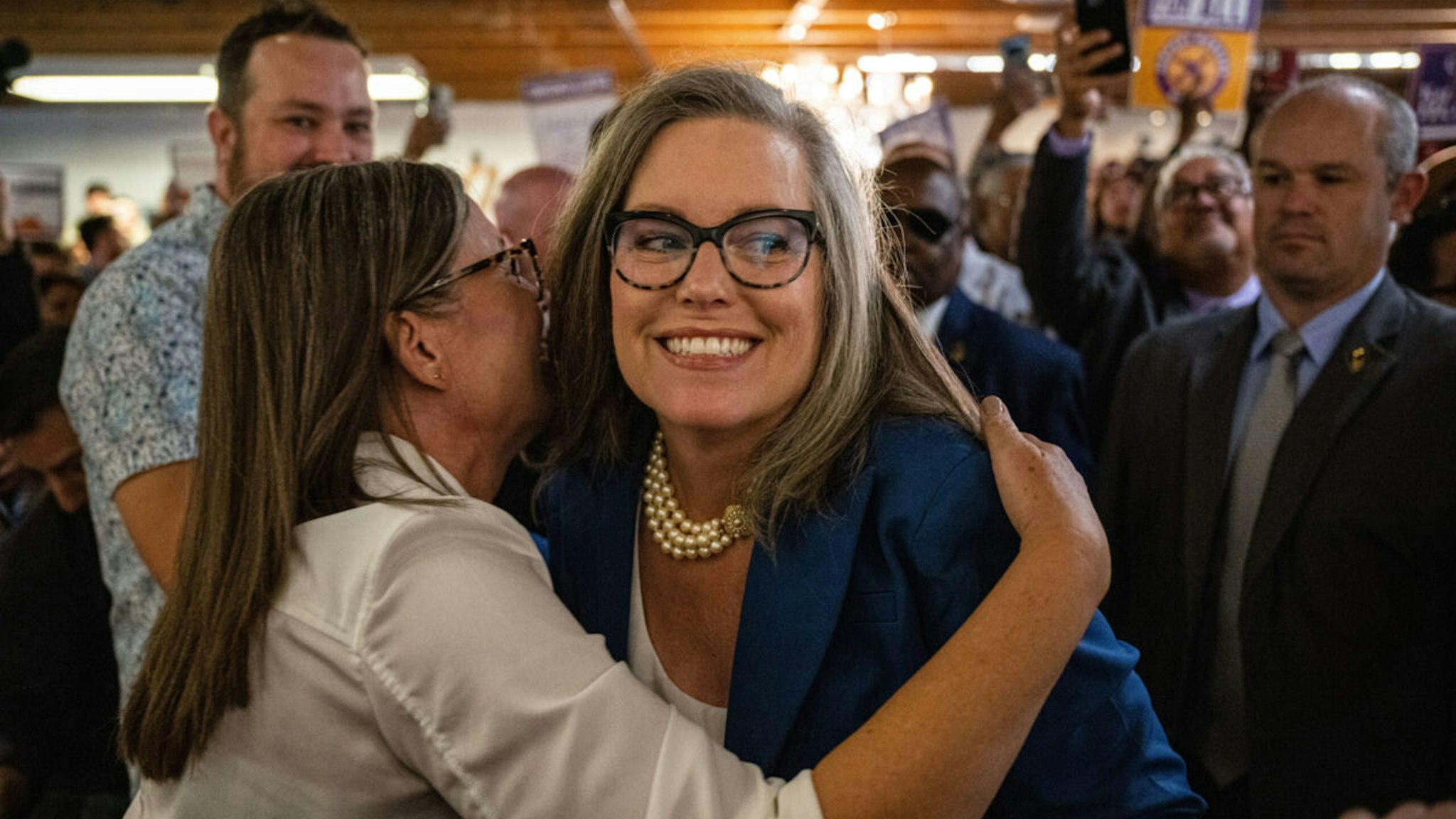 Governor-elect of Arizona Katie Hobbs hugs her twin sister, Becky Hobbs, at a rally to celebrate Hobbs' victory for Governor of Arizona on November 15, 2022 in Phoenix, Arizona. Major news organizations announced her win over Trump endorsed republican candidate for governor Kari Lake