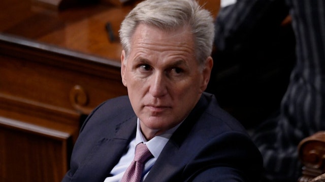 US Republican Representative of California Kevin McCarthy (L) listens as lawmakers take a 13th vote for House Speaker at the US Capitol in Washington, DC, on January 6, 2023.