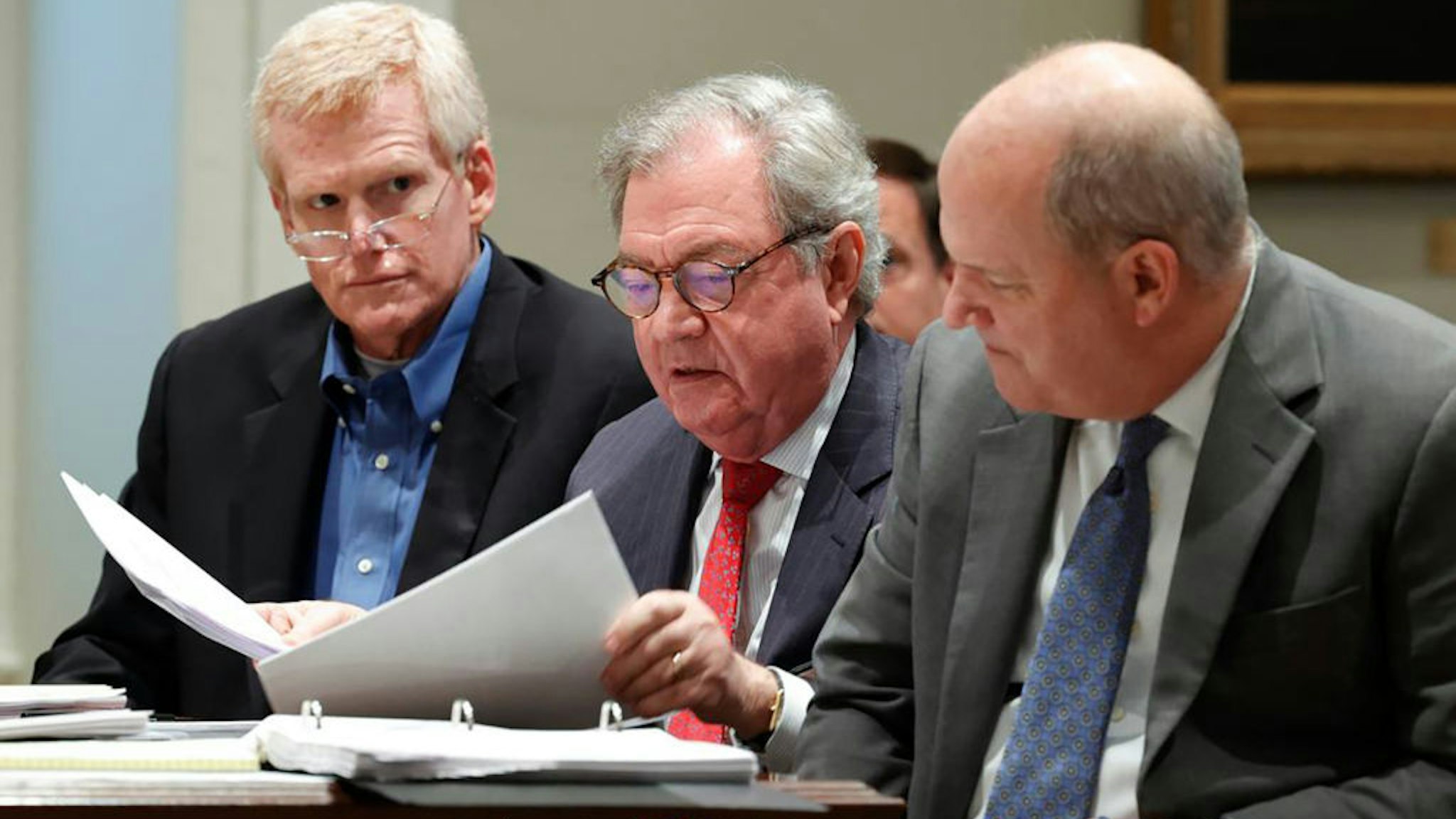 Alex Murdaugh sits in the Colleton County Courthouse with his legal team including Dick Harpootlian, middle, and Jim Griffin, right, as his attorneys discuss motions in front of Judge Clifton Newman in a December hearing.