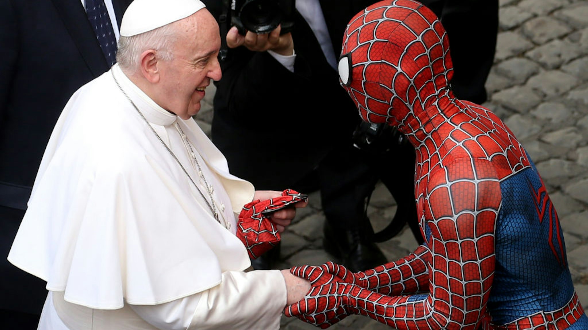 VATICAN CITY, VATICAN - JUNE 23: Pope Francis greets Mattia Villardita, a young man in the Spider-Man costume who makes children smile in the pediatric wards of hospitals, during his general audience at the courtyard of San Damaso on June 23, 2021 in Vatican City, Vatican. (Photo by