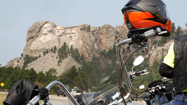 Bikers stop to take in Mt. Rushmore on August 09, 2021 near Keystone, South Dakota. Every August hundreds of thousands of motorcycling enthusiasts are attracted to the southwest corner of South Dakota for the annual Sturgis Motorcycle Rally.