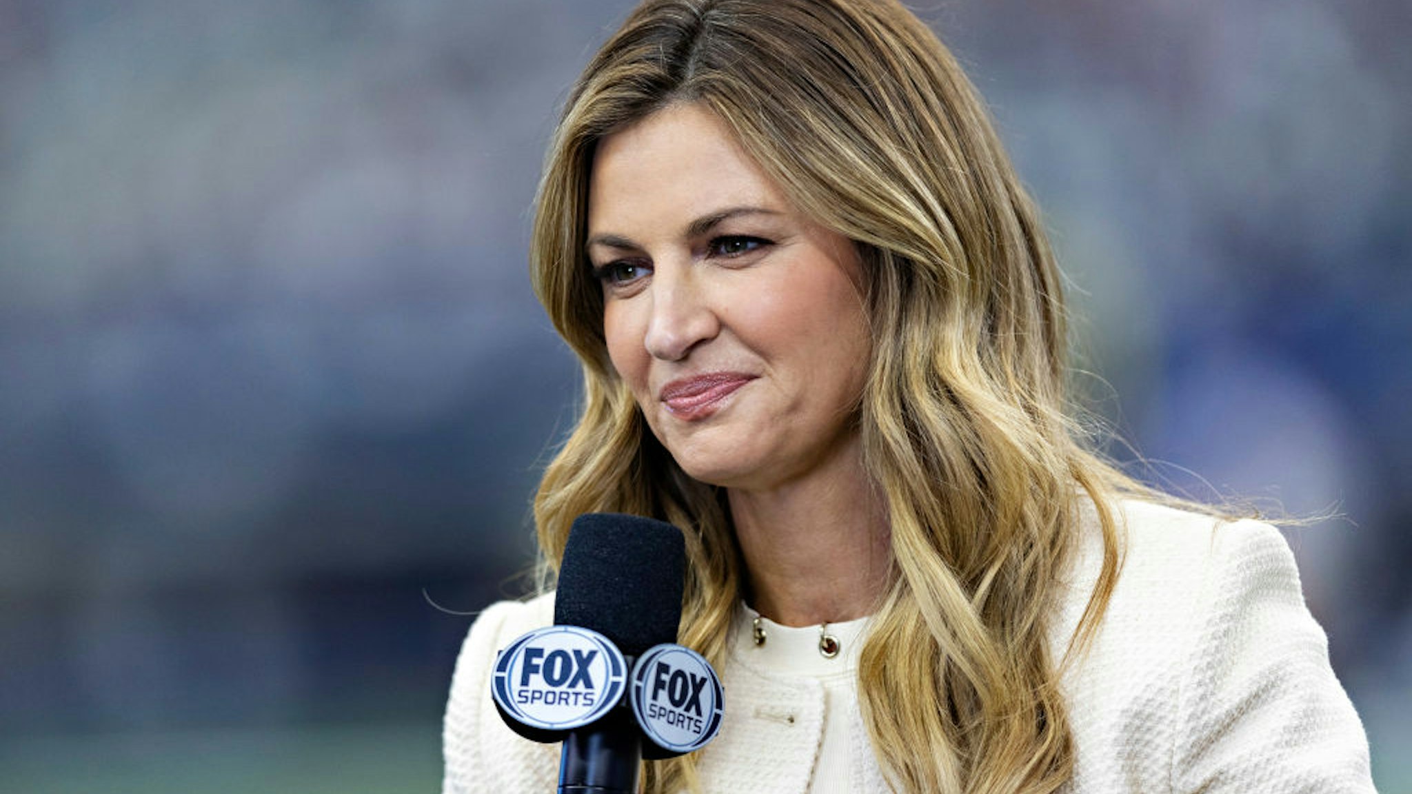ARLINGTON, TEXAS - OCTOBER 2: Fox Sports sideline reporter Erin Andrews on the field before a game between the Washington Commanders and the Dallas Cowboys at AT&amp;T Stadium on October 2, 2022 in Arlington, Texas. The Cowboys defeated the Commanders 25-10. (Photo by Wesley Hitt/Getty Images)