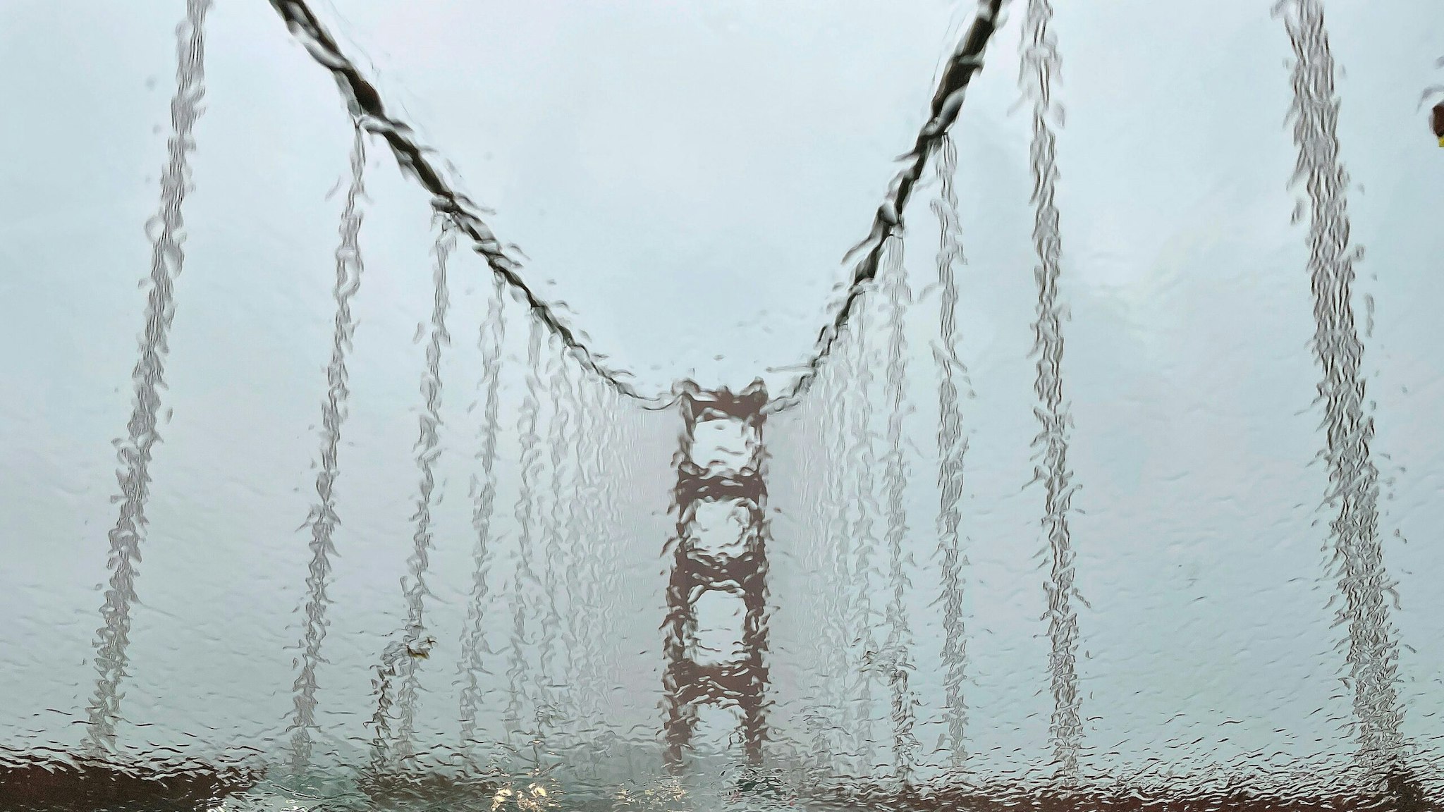 SAN FRANC, CALIFORNIA - JANUARY 04: The Golden Gate Bridge is seen through a rain covered windshield on January 04, 2023 in San Francisco, California. A massive storm is hitting Northern California bringing flooding rains and damaging wind