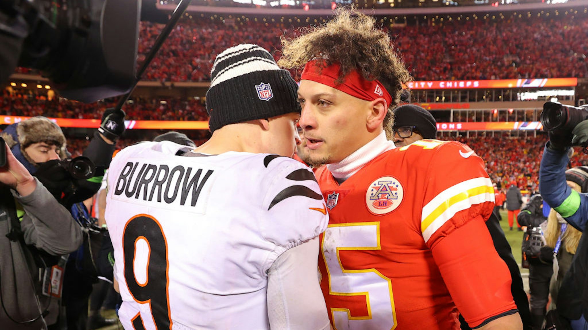 KANSAS CITY, MISSOURI - JANUARY 29: Joe Burrow #9 of the Cincinnati Bengals and Patrick Mahomes #15 of the Kansas City Chiefs meet on the field after the AFC Championship Game at GEHA Field at Arrowhead Stadium on January 29, 2023 in Kansas City, Missouri. (Photo by Kevin C. Cox/Getty Images)